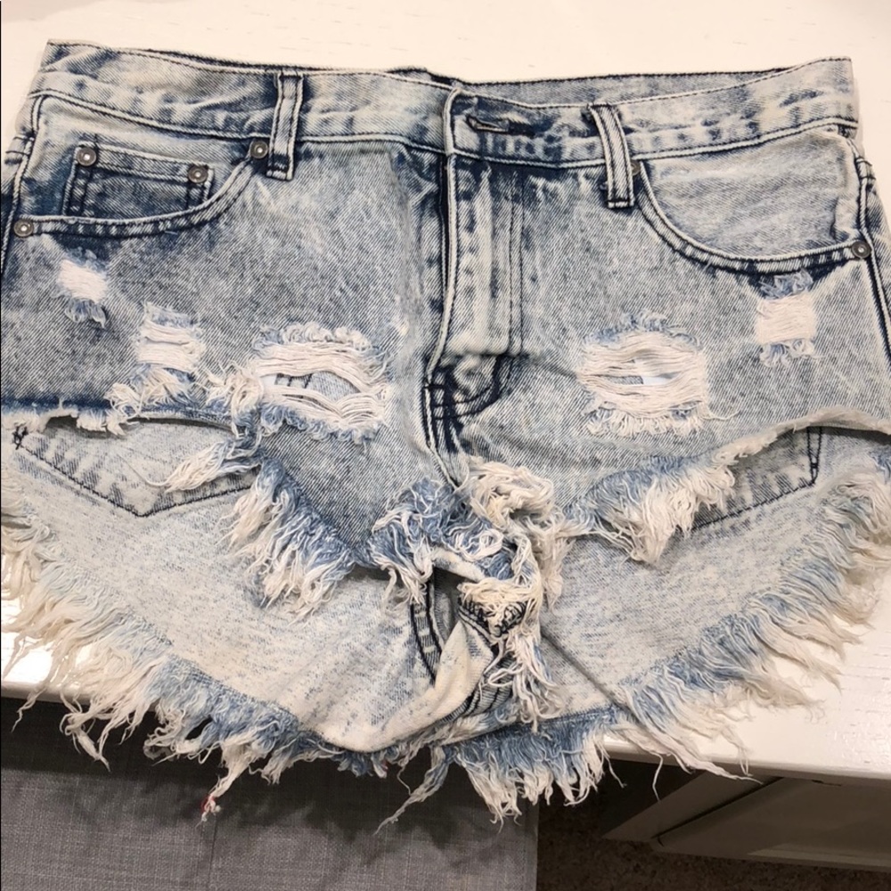 Worn one distressed light jean shorts